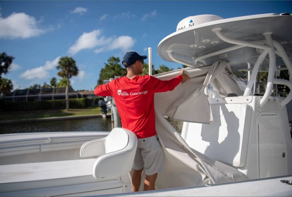 Captain Gabe cleaning the boat concierge services sarasota 3